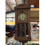 A MAHOGANY CASES WALL CLOCK WITH GLASS FRONT, APPROX 75CM X 33CM