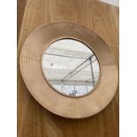 A WOODEN FRAMED CIRCULAR WALL MIRROR