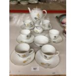 A BAVARIAN GERMANY CHINA TEASET WITH FLOWER PATTERN COMPRISING OF CUPS AND SAUCERS, TEAPOT, CREAM