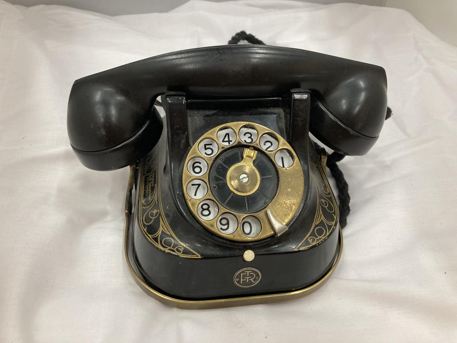 A VINTAGE BELGIAN TELEPHONE WITH GILDED DECORATION