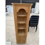 A PINE OPEN CORNER UNIT WITH CUPBOARD TO THE BASE, WITH GLASS KNOB, 22" WIDE