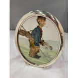 A FRAMED WATERCOLOUR OF A GOLFING CADDY SIGNED D F WILSON