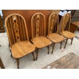 A SE OF FOUR REPRODUCTION WHEELBACK WINDSOR CHAIRS