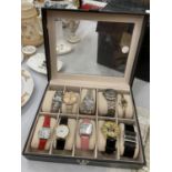 A DISPLAY BOX CONTAINING 10 FASHION WATCHES