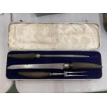 A BOXED VINTAGE CARVING SET