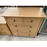 A MODERN OAK CHEST OF TWO SHORT AND THREE GRADUATED DRAWERS, 35.5" WIDE