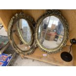 TWO SMALL GILT FRAMED MIRRORS AND A CANDLE HOLDER