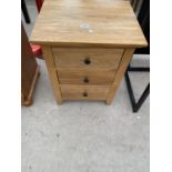 A MODERN OAK BEDSIDE CHEST