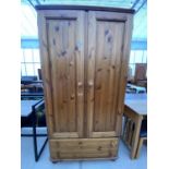 A MODERN TWO DOOR PINE VICTORIAN WARDROBE WITH TWO DRAWERS TO THE BASE, 37" WIDE