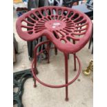 A VINTAGE TRACTOR/IMPLIMENT SEAT CONVERTED INTO AN ADJUSTABLE STOOL