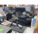 A SAMSUNG 40" TELEVISION WITH REMOTE CONTROL