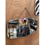 AN ART DECO UNFRAMED BEVELED EDGE MIRROR WITH HANGING CHAIN