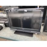 A SONY BRAVIA 26" TELEVISION WITH REMOTE CONTROL