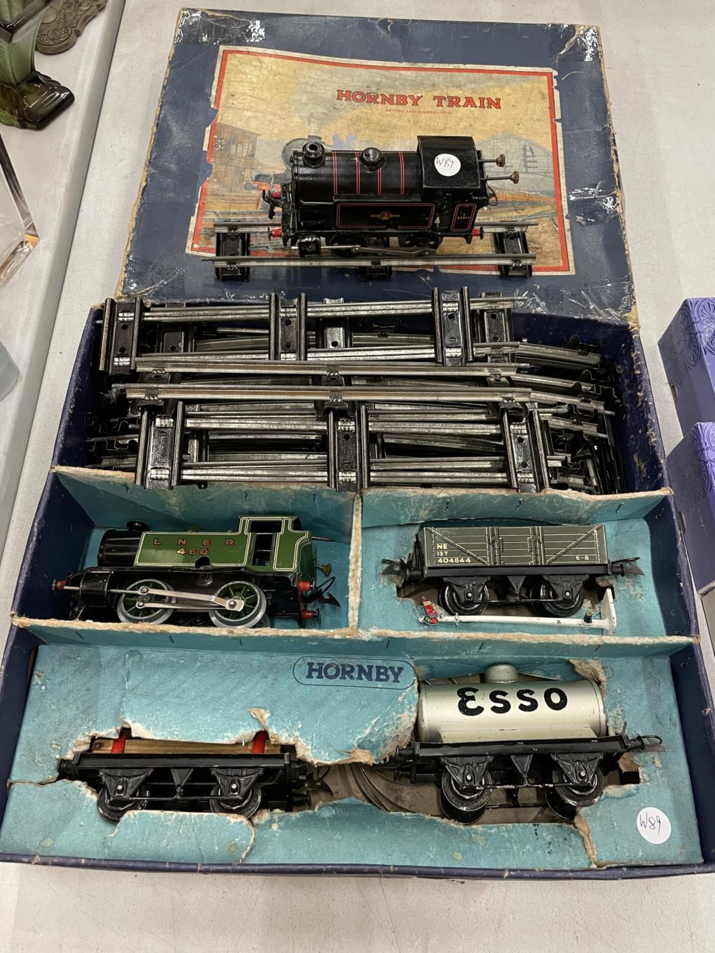 A HORNBY 'O' GAUGE TRAIN SET AND A HORNBY 'O' GAUGE BRITISH RAILWAYS LOCOMOTIVE IN ORIGINAL BOX. KEY