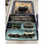 A HORNBY 'O' GAUGE TRAIN SET AND A HORNBY 'O' GAUGE BRITISH RAILWAYS LOCOMOTIVE IN ORIGINAL BOX. KEY