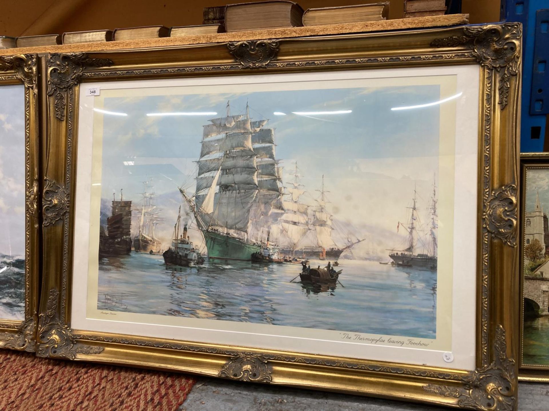 A LARGE ORNATE EMBOSSED GILT FRAMED PRINT OF THE THERMOPYLAE LEAVING FOOCHOW BY MONTAGUE DAWSON W: