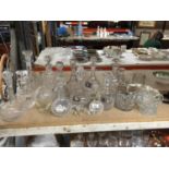 A QUANTITY OF GLASSWARE INCLUDING MAINLY DECANTERS, SOME WITH NAME TAGS PLUS A SCENT BOTTLE, BISCUIT