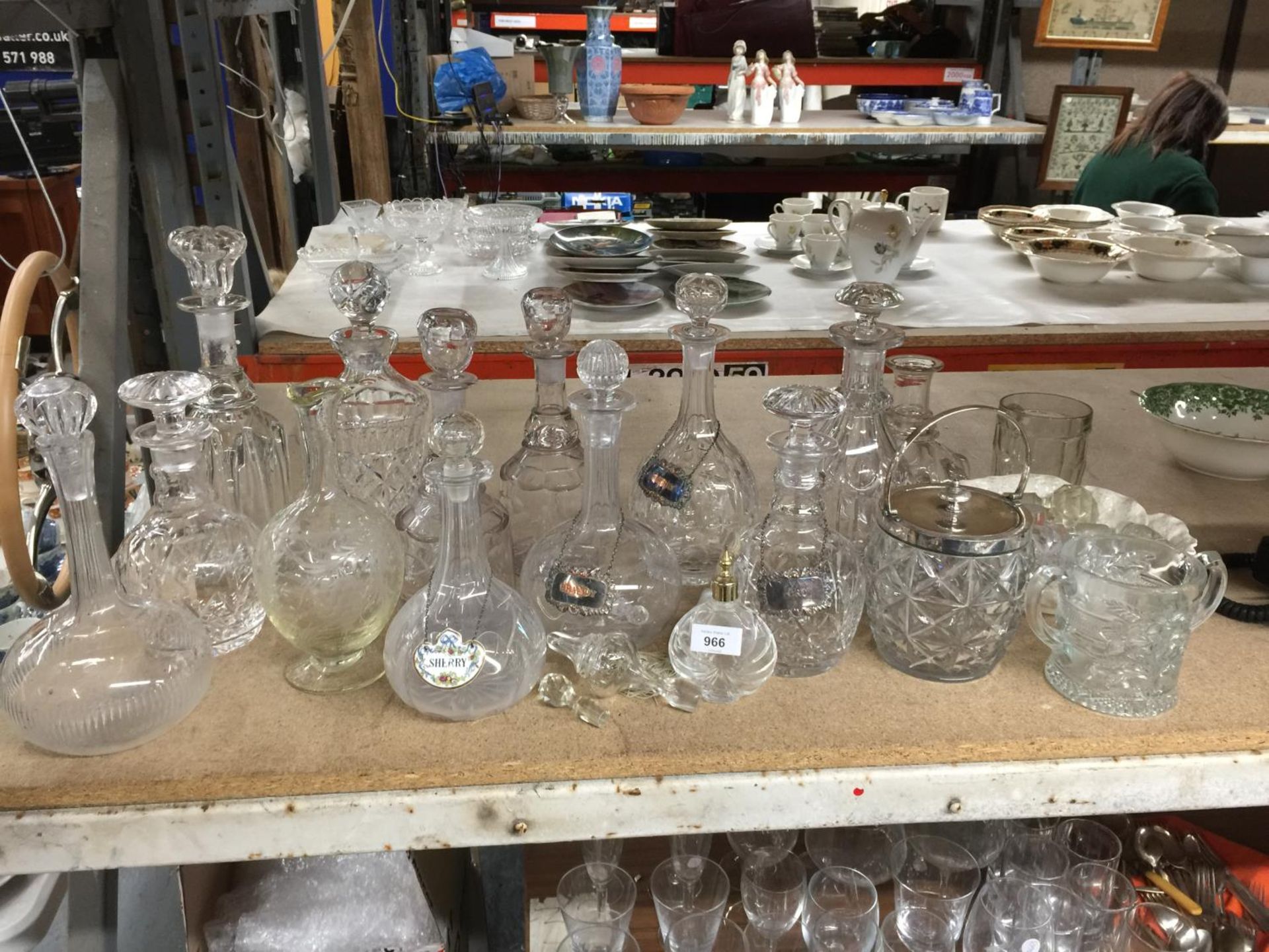 A QUANTITY OF GLASSWARE INCLUDING MAINLY DECANTERS, SOME WITH NAME TAGS PLUS A SCENT BOTTLE, BISCUIT