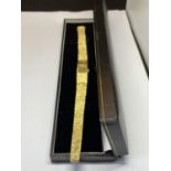 A YELLOW METAL VENTURA 17 JEWELS INCABLOC WRIST WATCH IN A PRESENTATION BOX