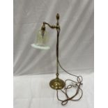 A HEAVY ANTIQUE ADJUSTABLE BRASS DESK LAMP WITH AN UNUSUAL GLASS SHADE