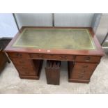 A REPRODUCTION MAHOGANY TWIN-PEDESTAL DESK WITH EIGHT DRAWERS AND INSET LEATHER TOP, COMPLETE WITH