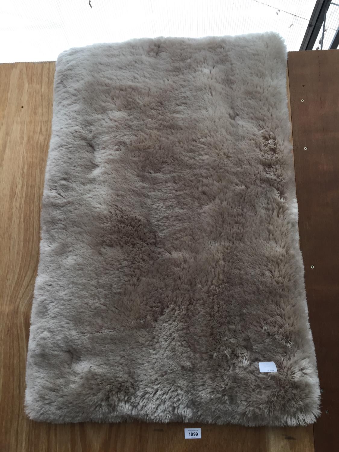 A MODERN SHEEP SKIN STYLE RUG