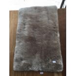 A MODERN SHEEP SKIN STYLE RUG