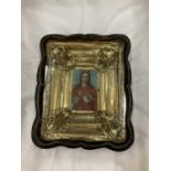 AN IMAGE OF AN EASTERN EUROPEAN ICON IN A GILT AND MAHOGANY FRAME SIZE 20CM X 26CM