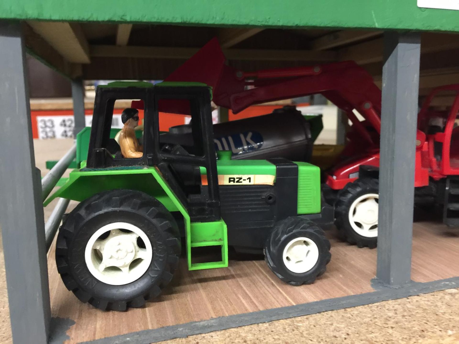 A HANDMADE WOODEN OPEN BARN CONTAINING TRACTORS, TRAILERS, ETC - Image 2 of 3