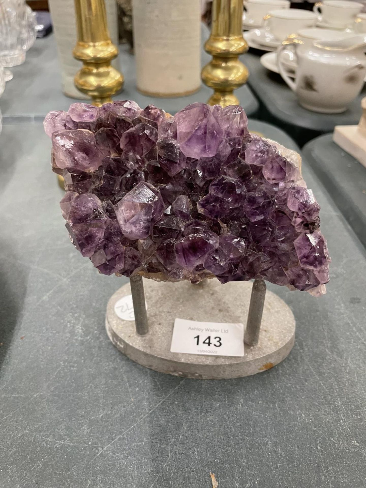 A PIECE OF AMETHYST ON A STAND