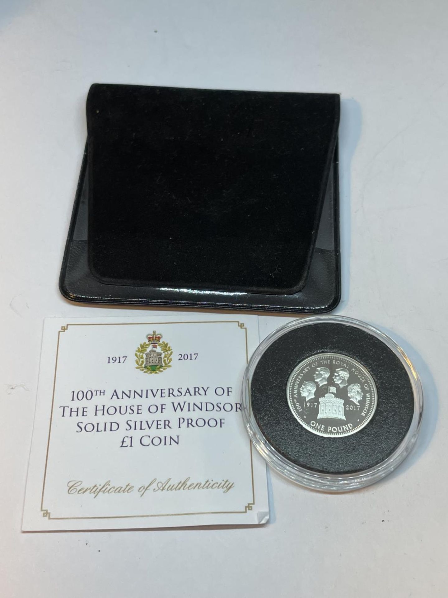 A 100TH ANNIVERSARY OF THE HOUSE OF WINDSOR SOLID SILVER PROOF £1 COIN WITH CERTIFICATE OF