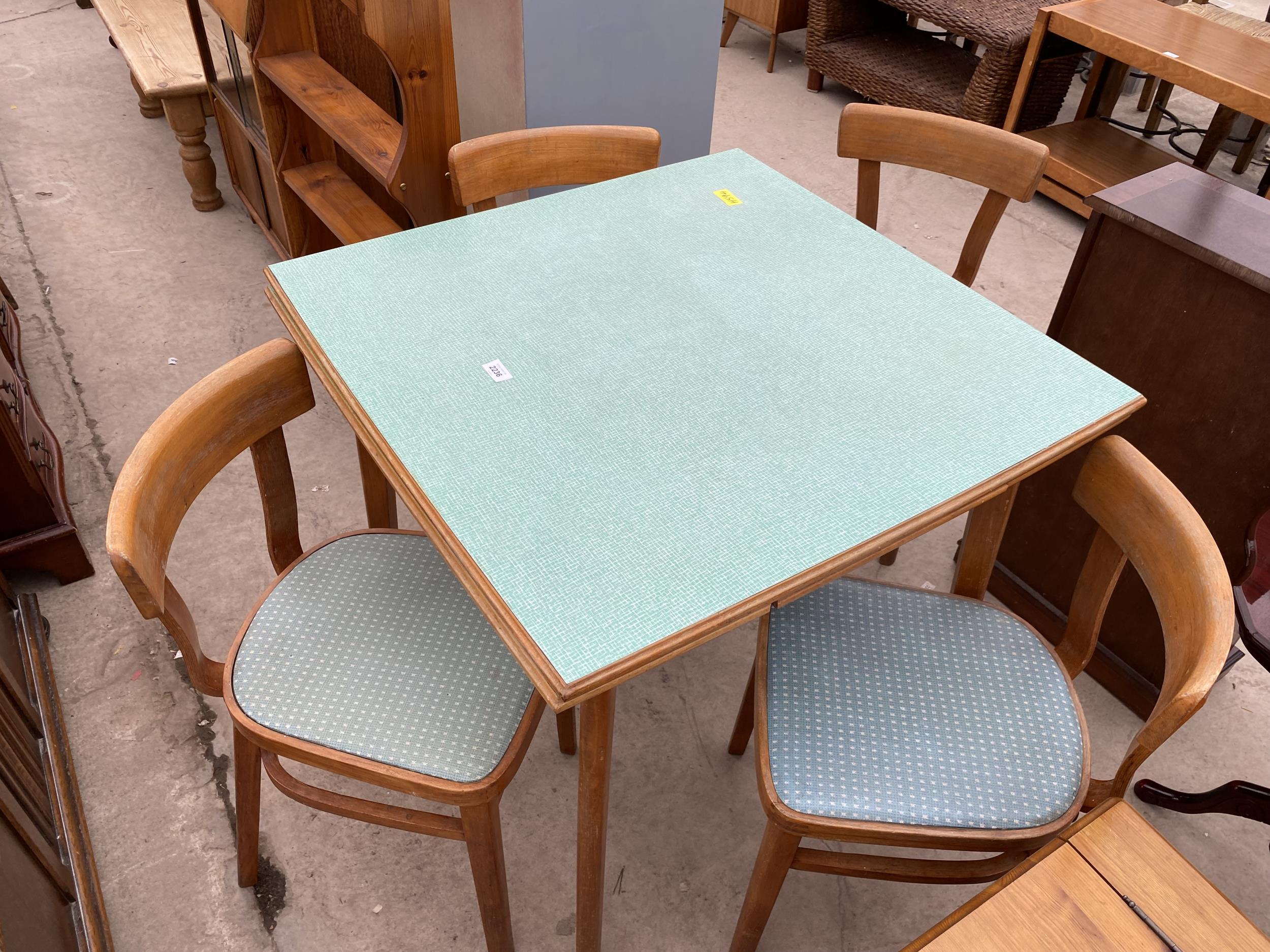 A 1950'S FORMICA TOP DRAW-LEAF KITCHEN TABLE AND FOUR CHAIRS