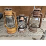 TWO VINTAGE MID CENTURY PARAFIN LAMPS TO INCLUDE ONE BEARING THE NAME CHALWYN AND ONE BEARING THE
