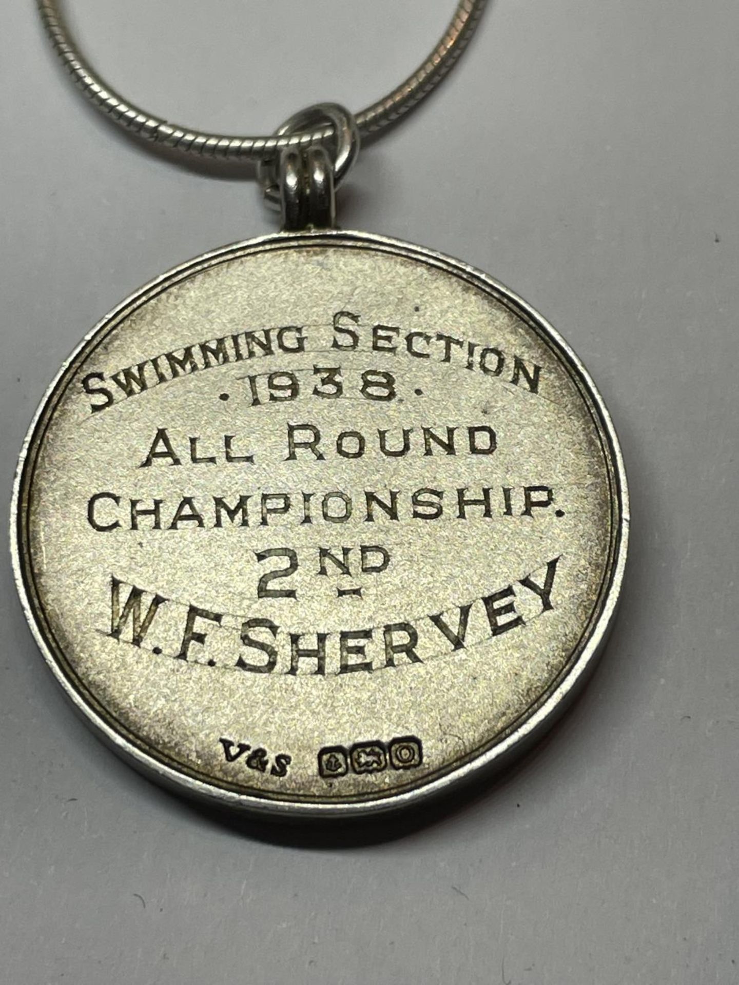 TWO MARKED SILVER CHAINS WITH PENDANTS TO INCLUDE A 1964 HALF DOLLAR AND A FURTHER MEDAL - Image 5 of 5