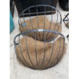 A PAIR OF LARGE WROUGHT IRON HAYRACK PLANTERS WITH INSERTS