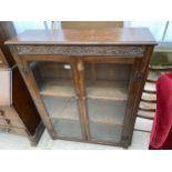 A MID 20TH CENTURY OAK TWO DOOR GLAZED BOOKCASE, 37" WIDE