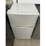 A SMALL WHITE FRIDGE FREEZER