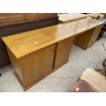 A FRASER EAGLE TWIN PEDESTAL DESK AND CABINET