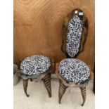 A VINTAGE WROUGHT IRON CHAIR AND A STOOL WITH UPHOLSTERED SEATS
