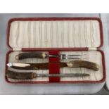 A BOXED VINTAGE BONE HANDLED CARVING SET