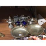 A QUANTITY OF SILVER PLATED ITEMS INCLUDING TEAPOTS, HANDLED BASKETS, BOWLS WITH BLUE GLASS