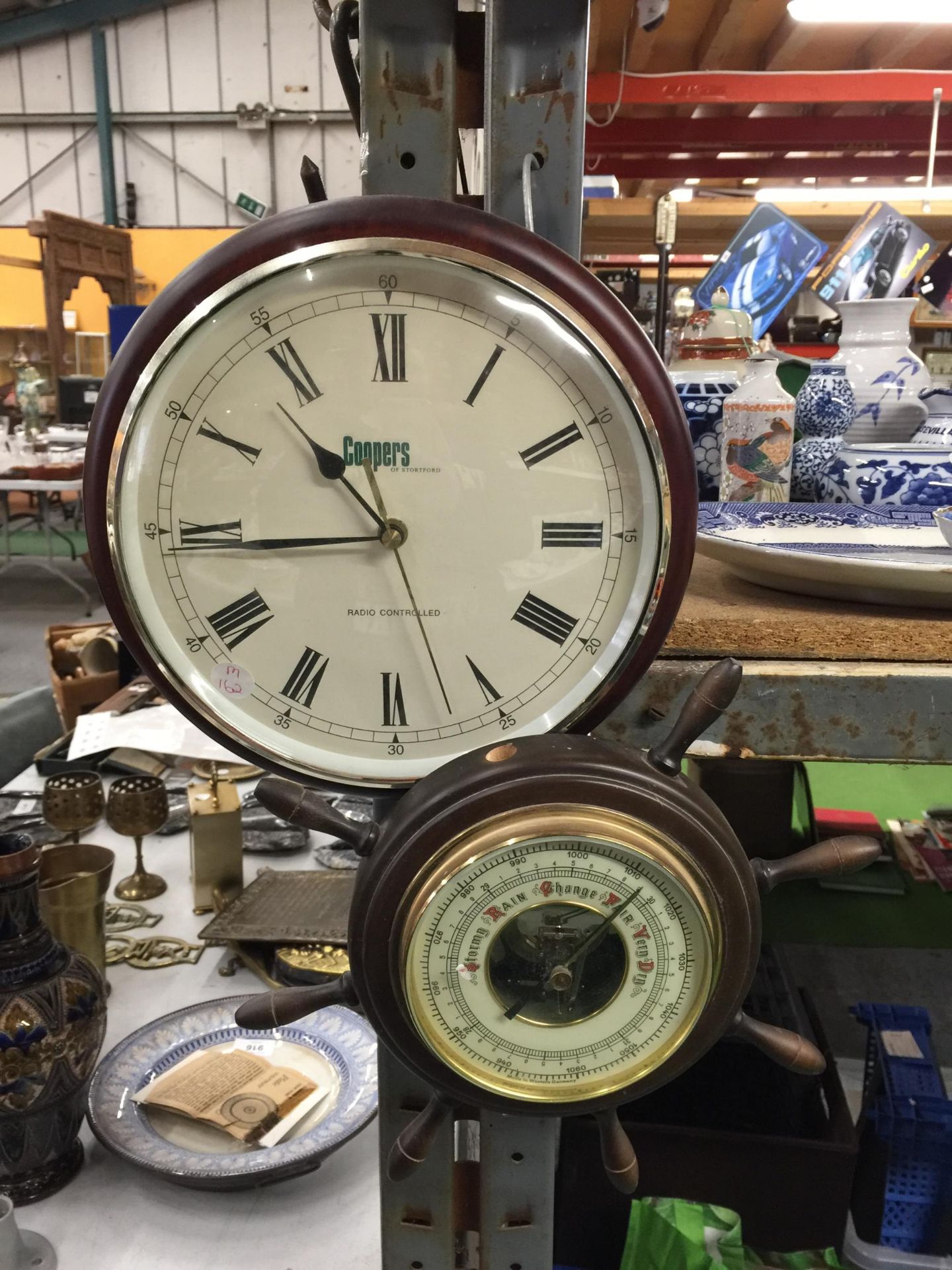 TWO WALL CLOCKS (COOPERS AND ARTEX) AND A SMALL SHIPS WHEEL BAROMETER, MISSING ONE OF THE SPOKES - Image 2 of 3