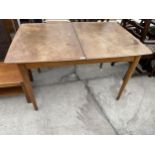 A RETRO TEAK EXTENDING DINING TABLE