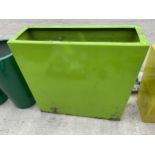 A LARGE GREEN FIBRE GLASS PLANTER (H:90CM W:90CM)