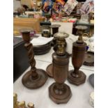 TWO PAIRS OF WOODEN CANDLESTICKS TO INCLUDE BARLEY TWIST AND SILVER PLATED TOPS