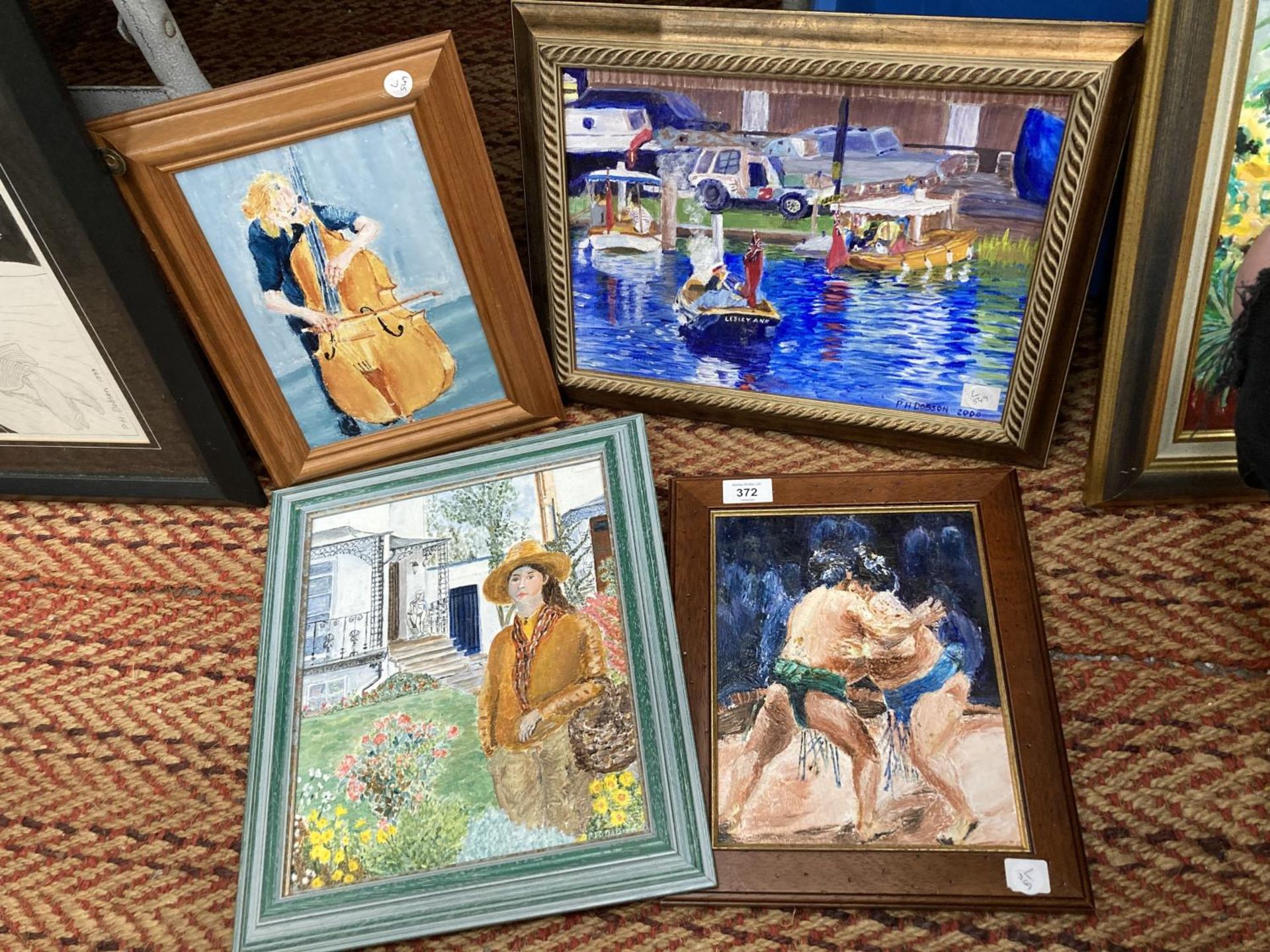 FOUR FRAMED OIL ON CANVAS DEPICTING A MAN PLAYING A CELLO, SUMO WRESTLERS FIGHTING, A LADY