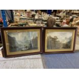 A VERY LARGE PAIR OF FRAMED PRINTS DEPICTING A WOODLAND LAKE SCENE WITH WILDLIFE AND MOUNTAINOUS