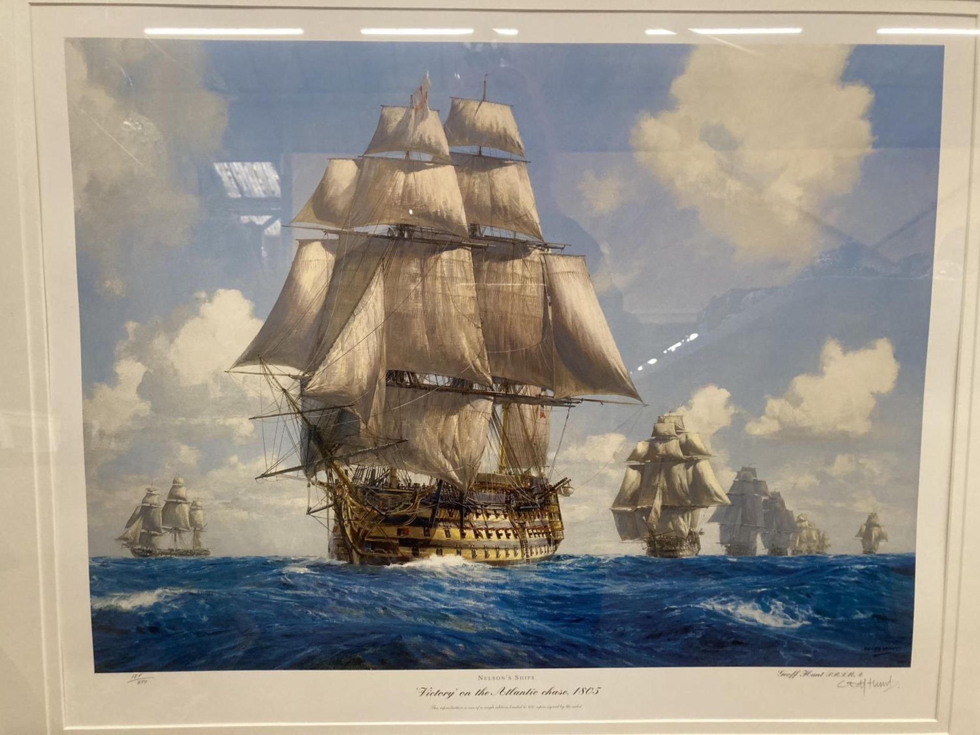 A LARGE GILT FRAMED SIGNED LIMITED EDITION PRINT OF NELSON'S SHIPS TITLED 'VICTORY ON THE ATLANTIC