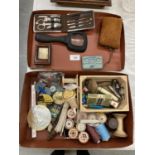 A CASE CONTAINING A VARIETY OF COLLECTABLES TO INCLUDE A MAGNIFYING GLASS, COTTON REELS, LETTER
