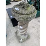 A RECONSTITUTED STONE GARDEN ORNAMENT